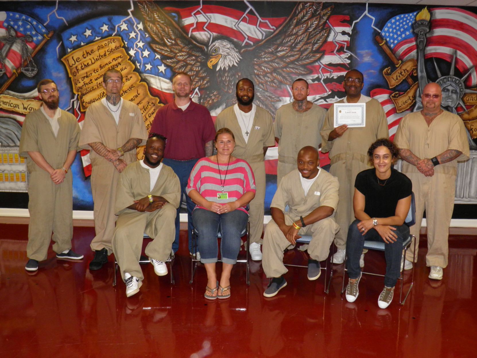 Indiana Prison Writers Workshop instructor Tiffany Leininger (left) and Debra Des Vignes (right) with inmates at Putnamville Correctional Facilty
